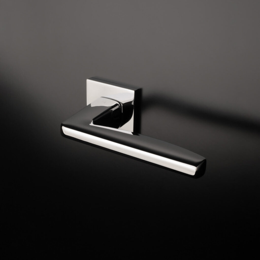 Aprile high-quality interior door handle in polished chrome finish, featuring a modern square base and sleek, minimalist design – perfect for adding elegance and sophistication to any contemporary home decor.